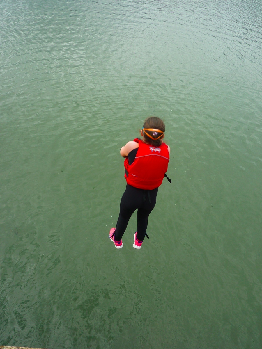 A mid air shot of Caitlin jumping off the pier… Well done!