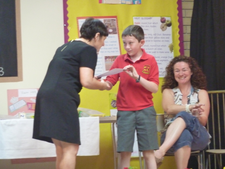 Tiernan receives his prize for finding the balloon furthest away from the school after the garden party.